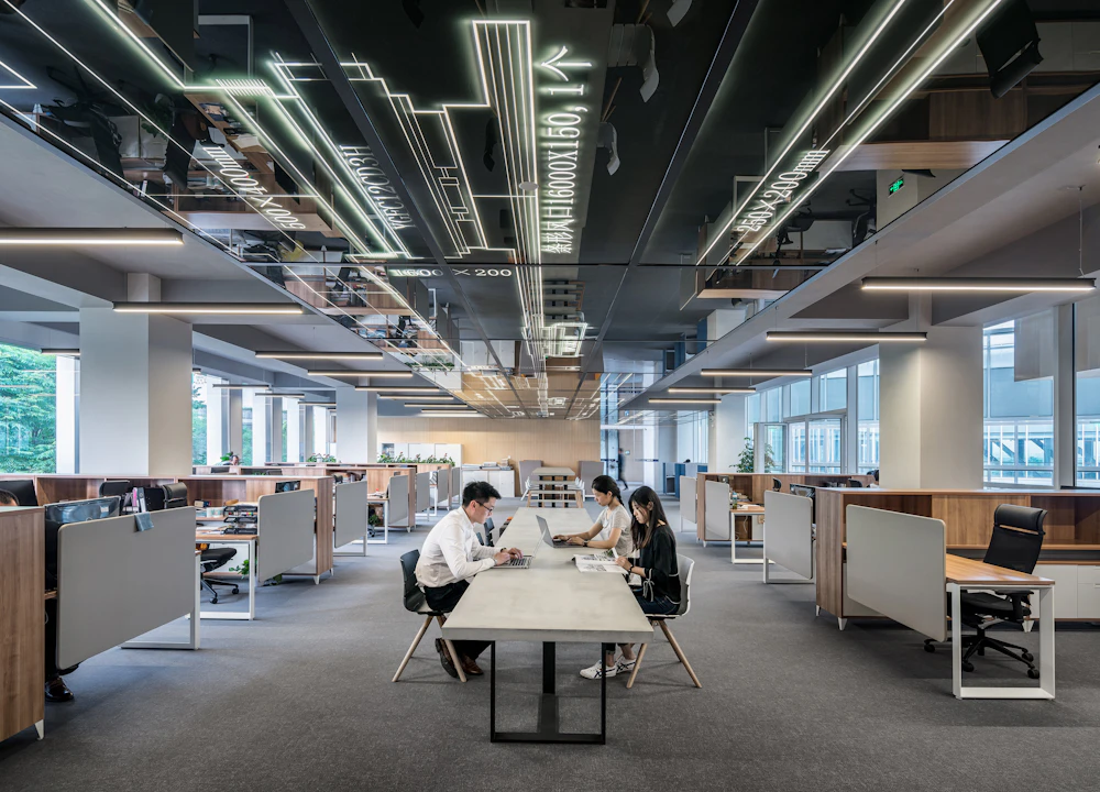 An open-plan office floor with teams at work