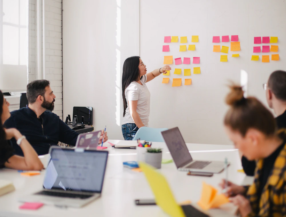 A team working together around a table in a bright modern office