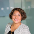 Portrait of a smiling OVP assistant in a blazer