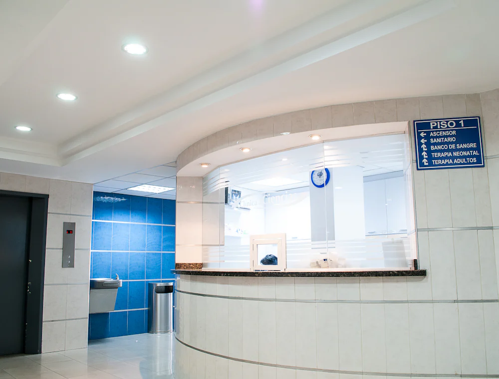 A clinic reception desk in a quiet corridor