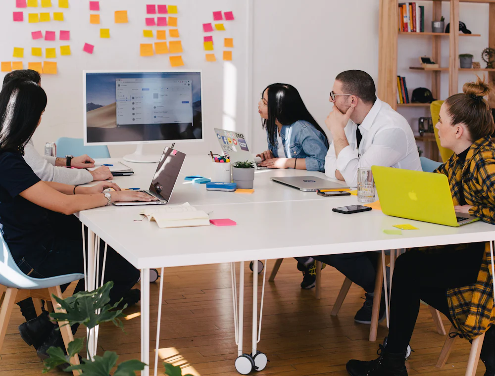 A team working together around a table in a modern office