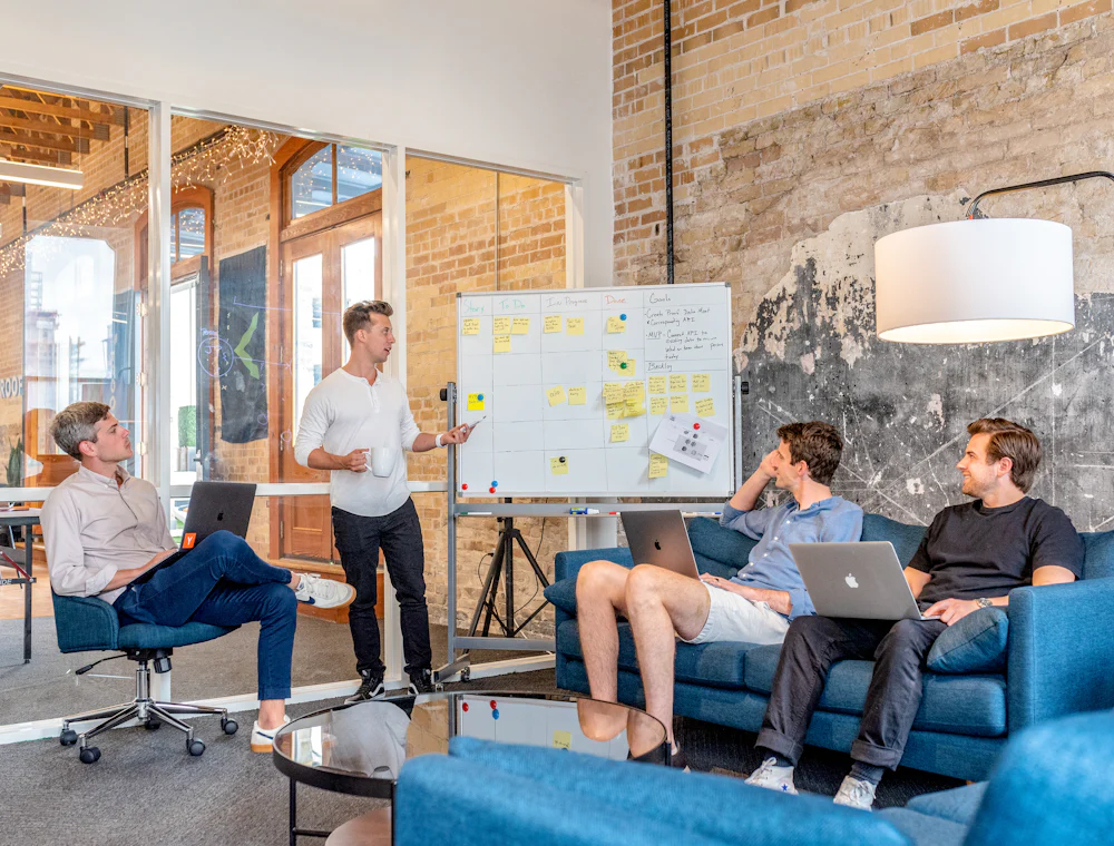An agency team working around a whiteboard